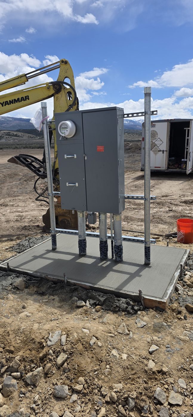 400 amp meter base and service equipment set on a new concrete pad, rural Utah